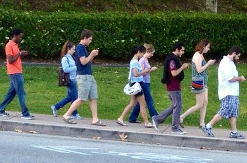 group-of-people-walking-and-texting1